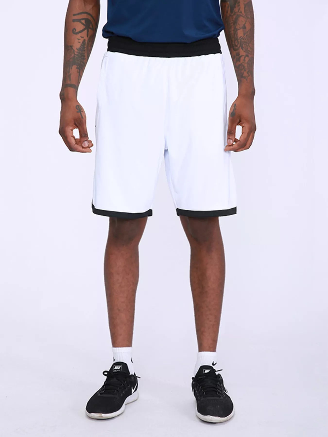 Men's white active shorts with star print and lightweight, breathable fabric.