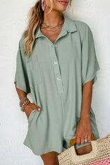 Women's sage romper with half sleeves, button detailing, and pockets.