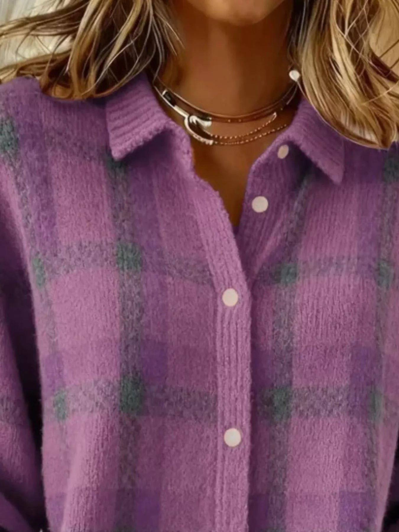Close-up of the collar and button placket on a light purple plaid knit cardigan