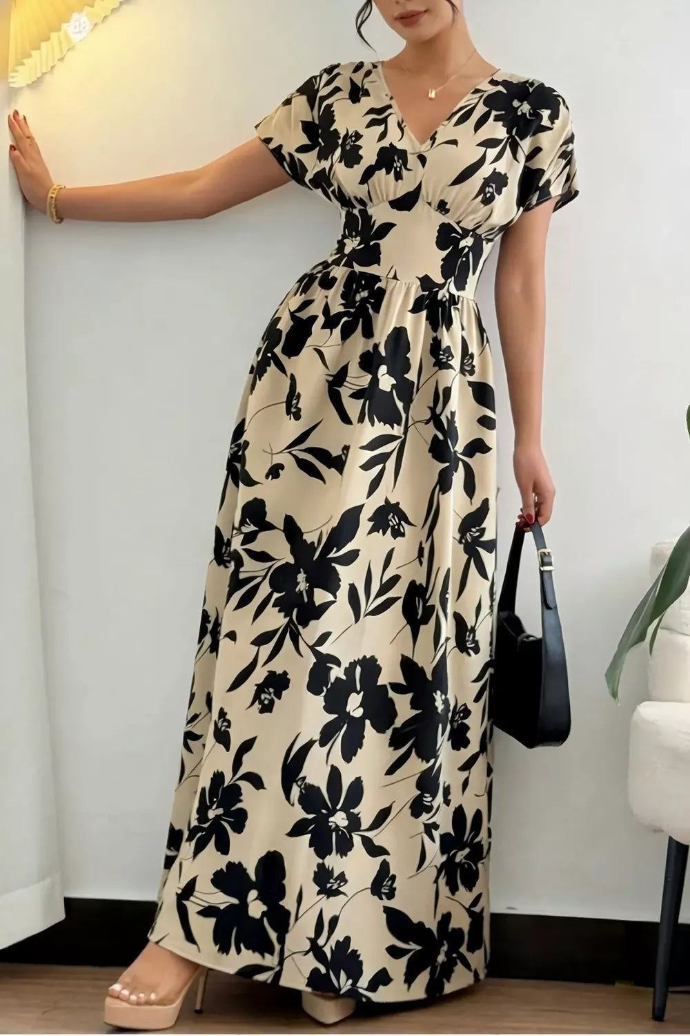 Front view of khaki floral short sleeve maxi dress with V neckline and flared skirt