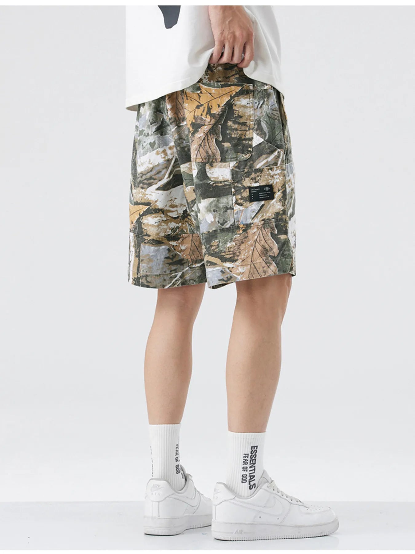 Men's loose fit shorts with a drawstring waist and pockets.