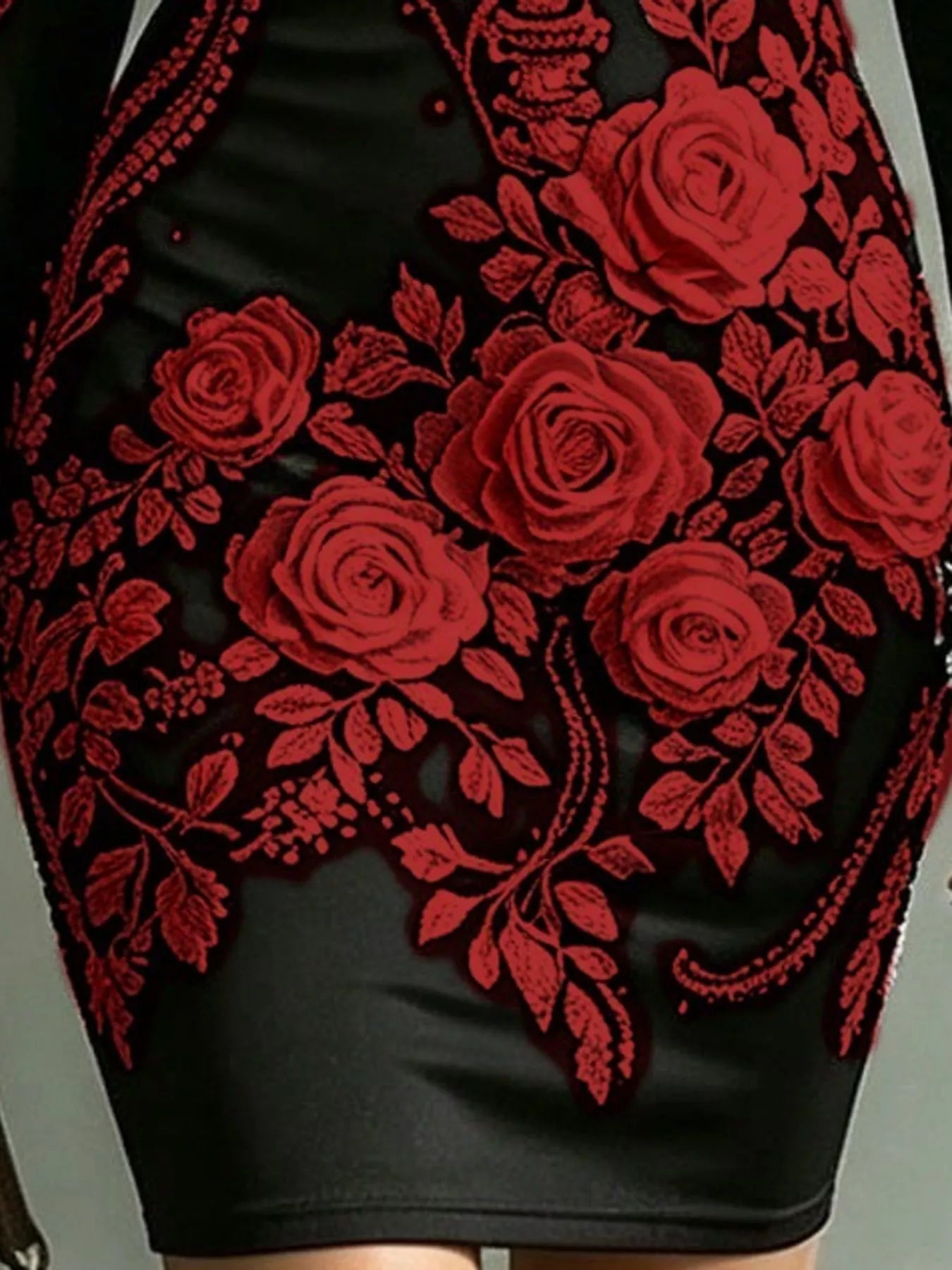Close detail of dark red rose print on black long sleeve bodycon dress skirt