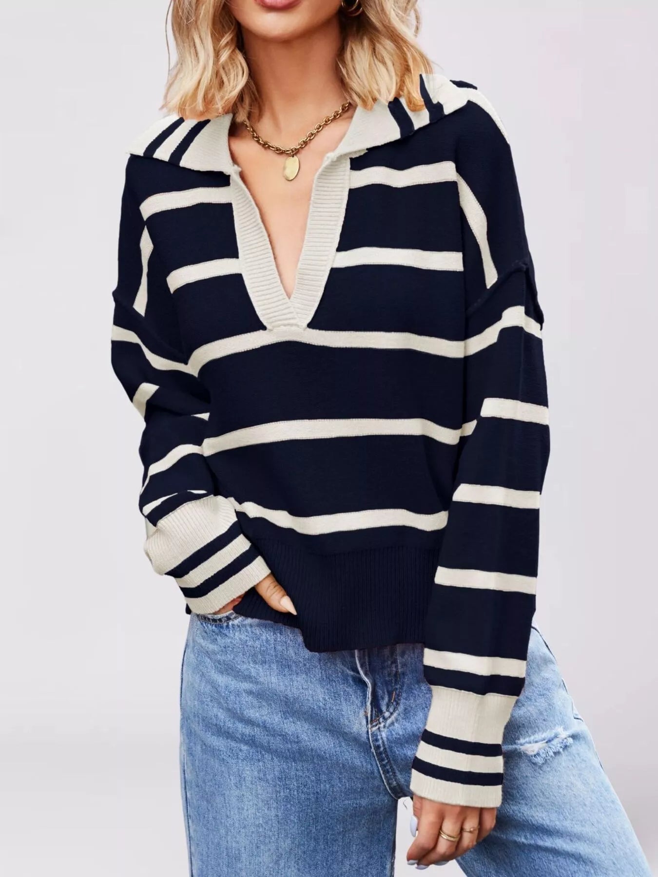 On-model front view of dark navy striped sweater with cream Johnny collar and dropped shoulders
