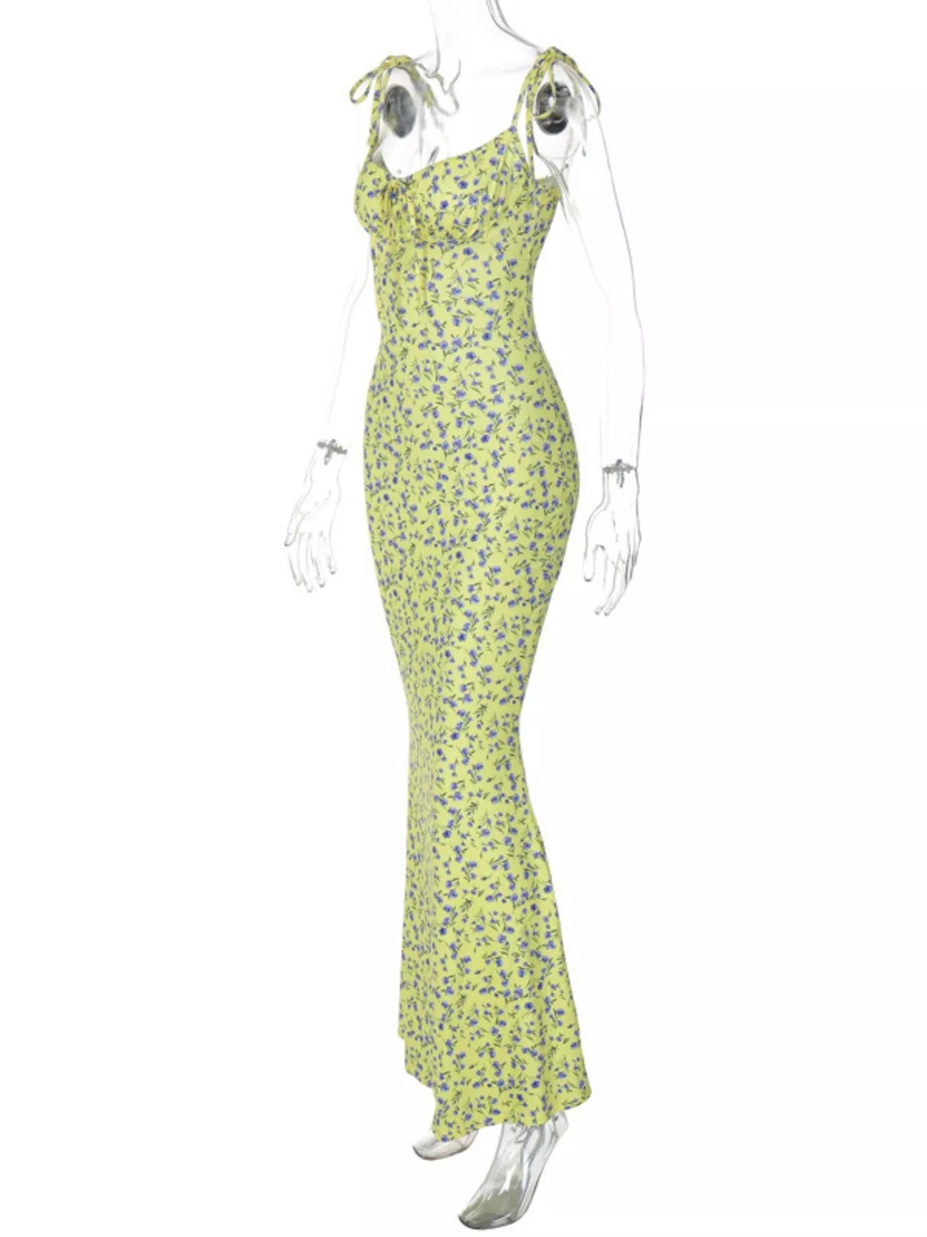 Side angle of clear mannequin wearing yellow floral print bodycon maxi dress with tie straps