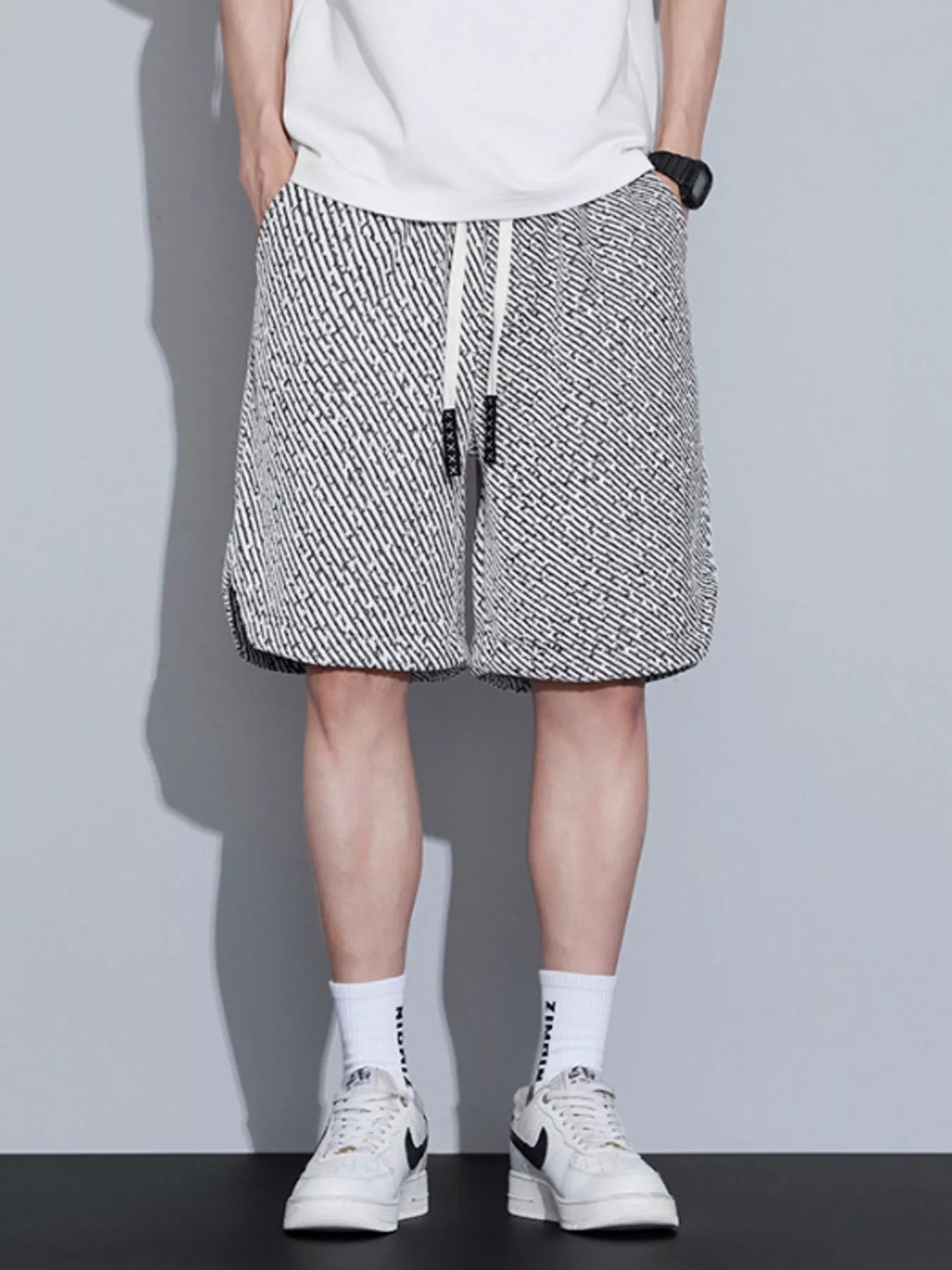 Men's loose fit shorts with a drawstring waist and pockets.