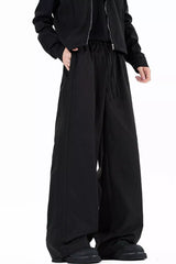 Men's wide leg casual pants with a drawstring waist and pockets.