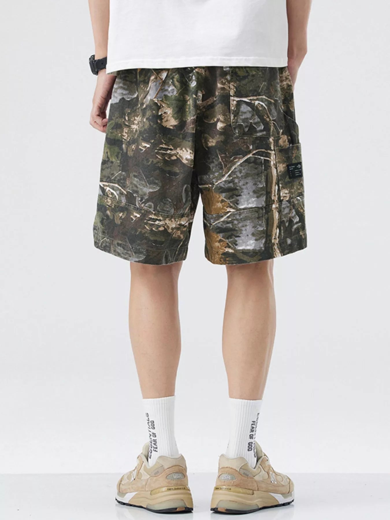 Men's loose fit shorts with a drawstring waist and pockets.