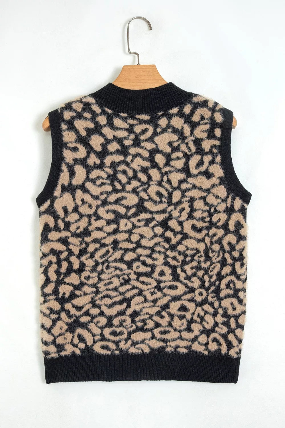 Back view of leopard print knit vest on a hanger, with black ribbed trim.
