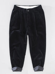 Men's pleated corduroy casual pants with pockets.