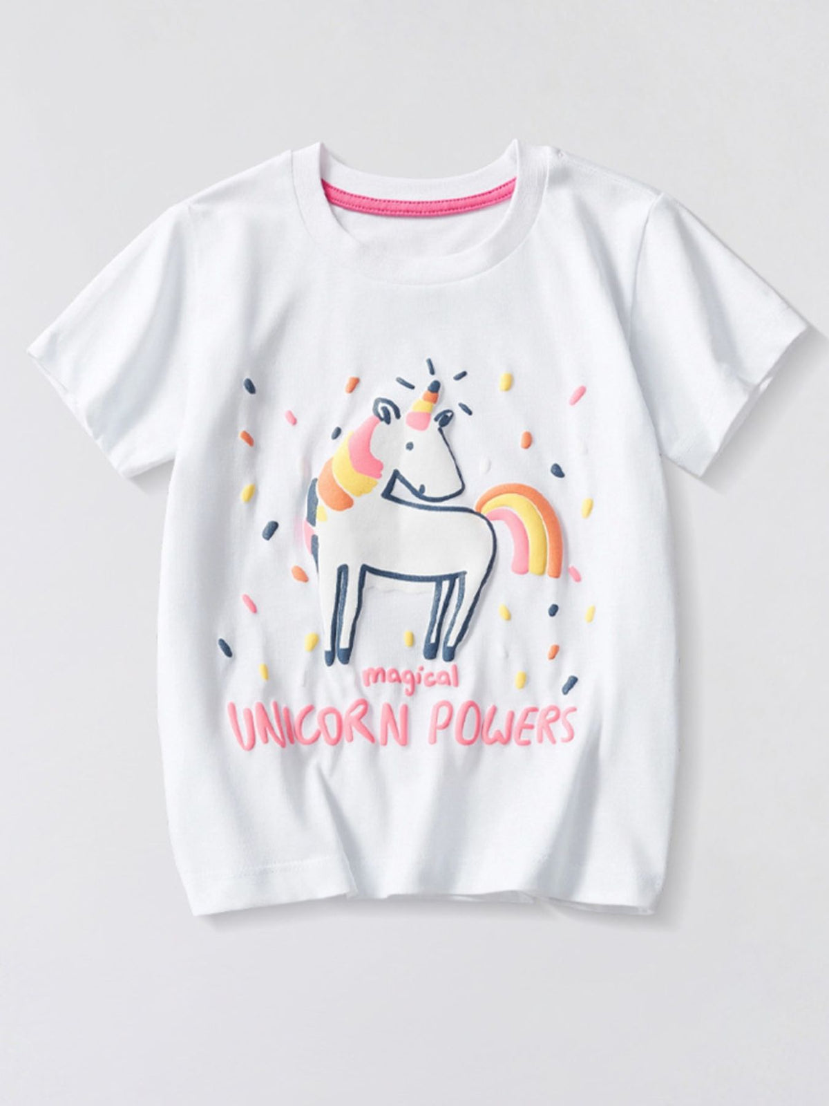 Flat front view of a white children's tee with a rainbow unicorn graphic and pink lettering below