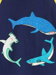 Close-up of three shark prints, including a spotted shark and a hammerhead shark