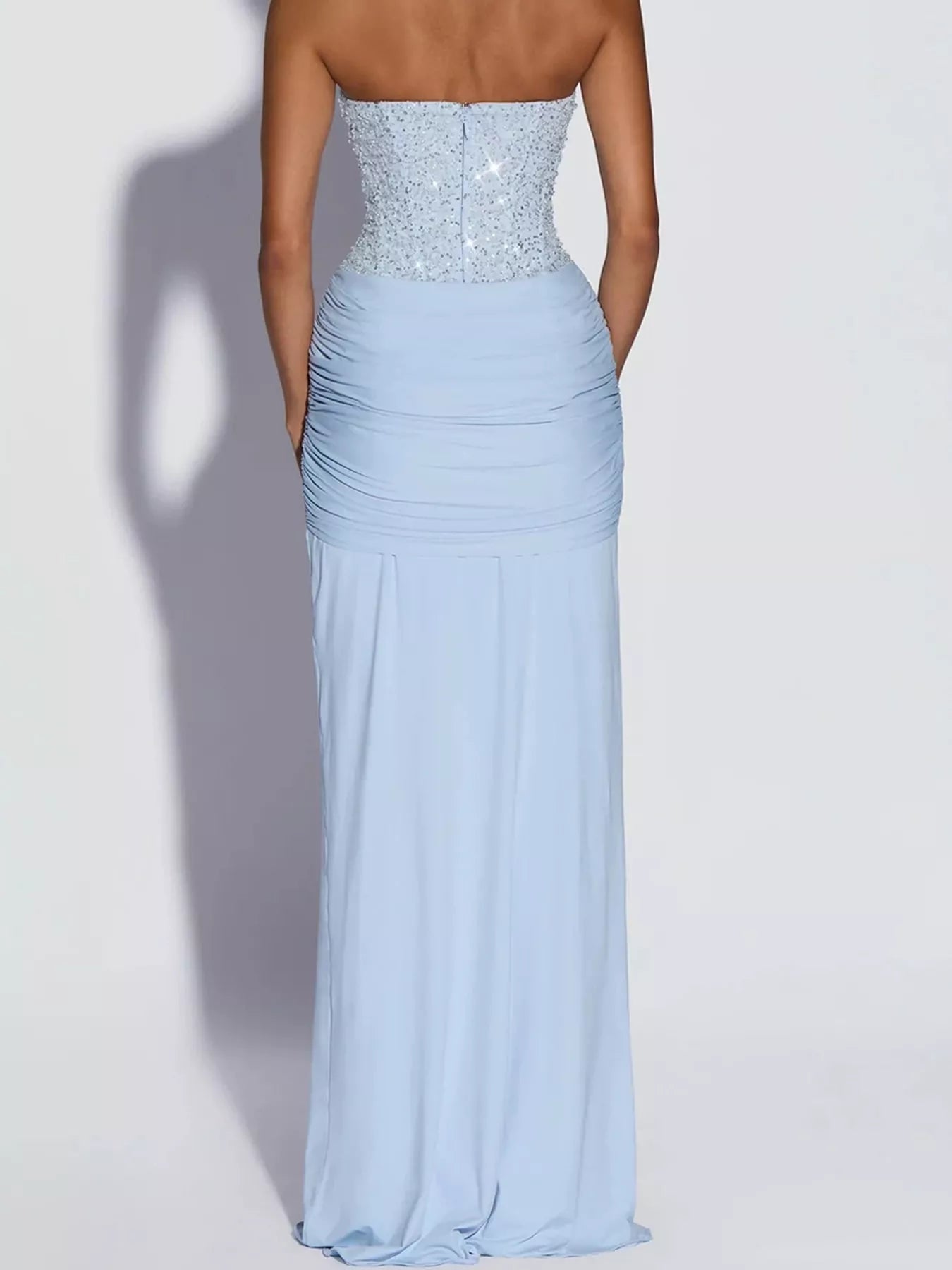 Blue strapless sequin corset maxi dress on model, full length back view showing zip
