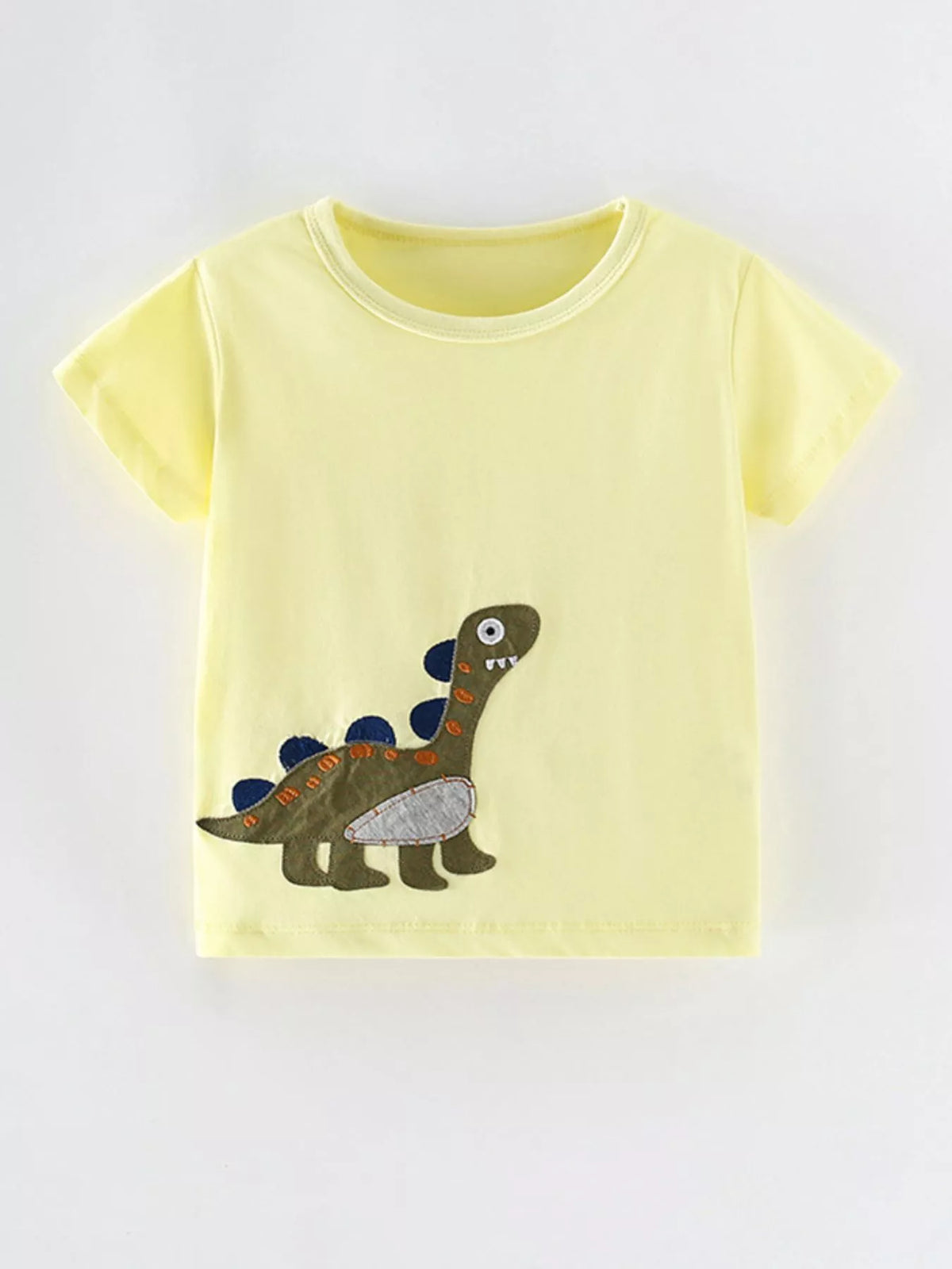 Front view of a light yellow children's short sleeve shirt with a green dinosaur applique near the hem