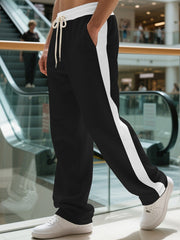 Men's contrast stripe sweatpants with a drawstring waist and pockets.