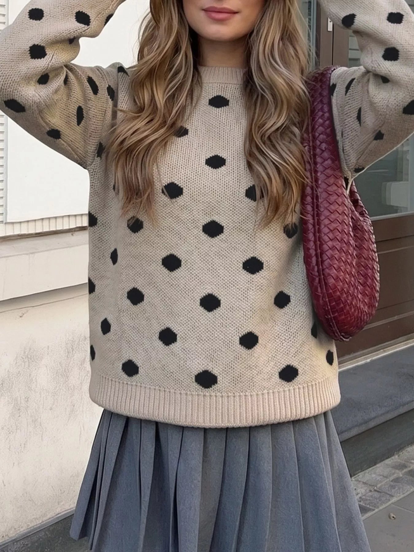 Khaki polka dot dropped shoulder sweater shown front on with arms raised