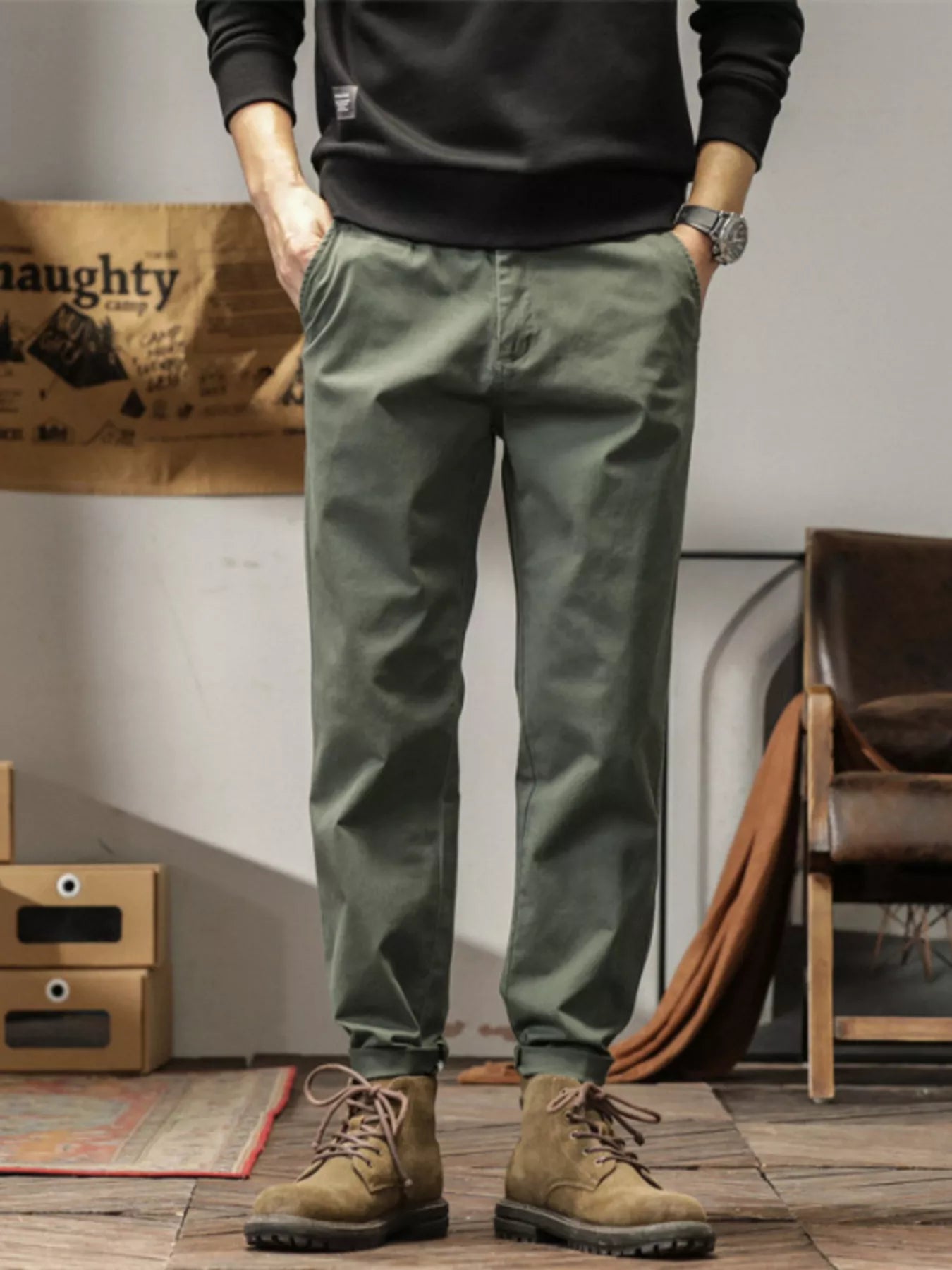 Men's slim fit casual pants with banded ankles and pockets.