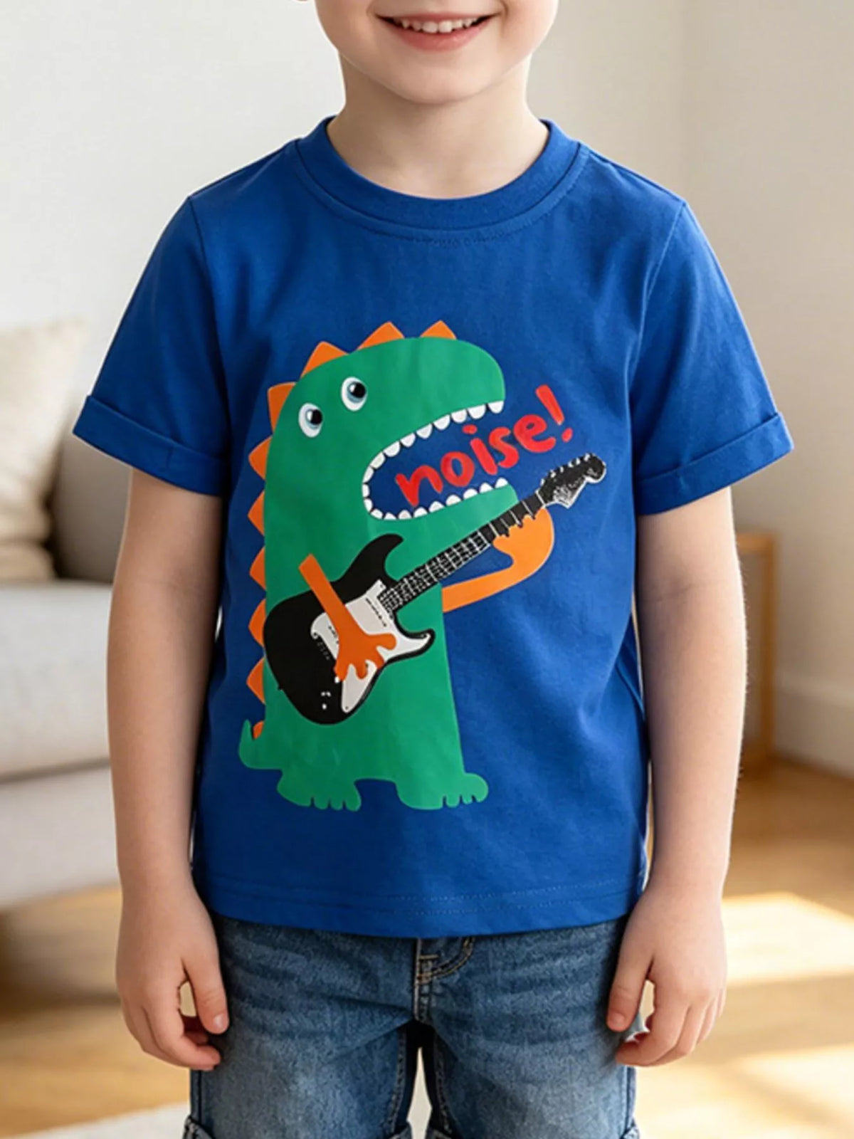 Worn front view of royal blue children's t-shirt with green guitar playing dinosaur