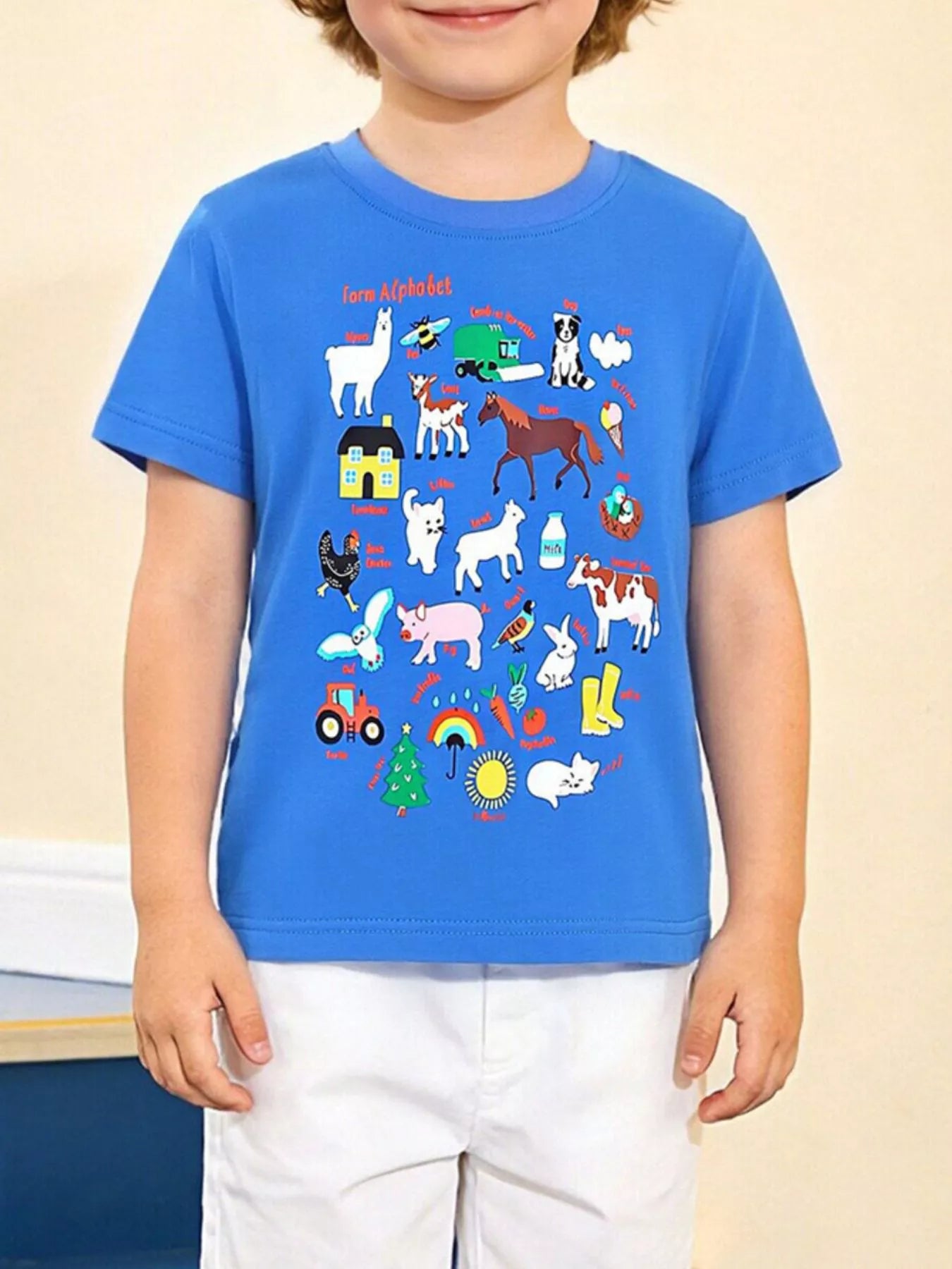 Children's royal blue crew-neck T-shirt featuring a farm alphabet print.