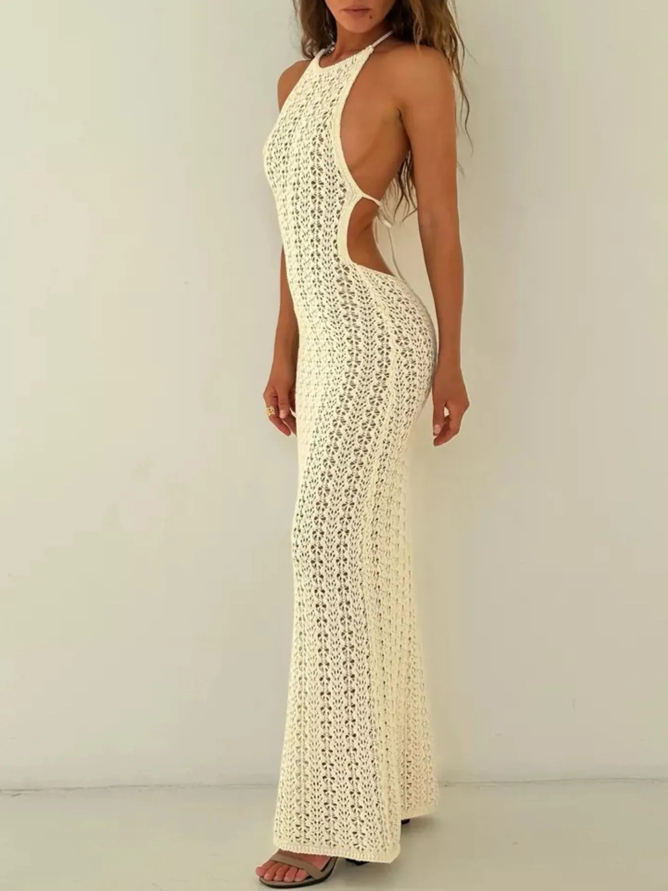 Side profile view of beige crochet halter neck bodycon knit cover up dress