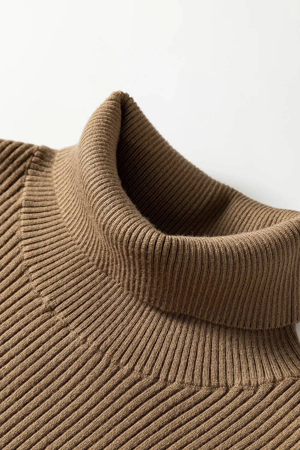 Close up of the folded mocha ribbed mock neck and knit texture