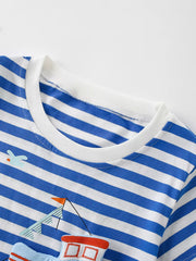 Close up of the white round neckline on a children's blue and white striped short sleeve tee