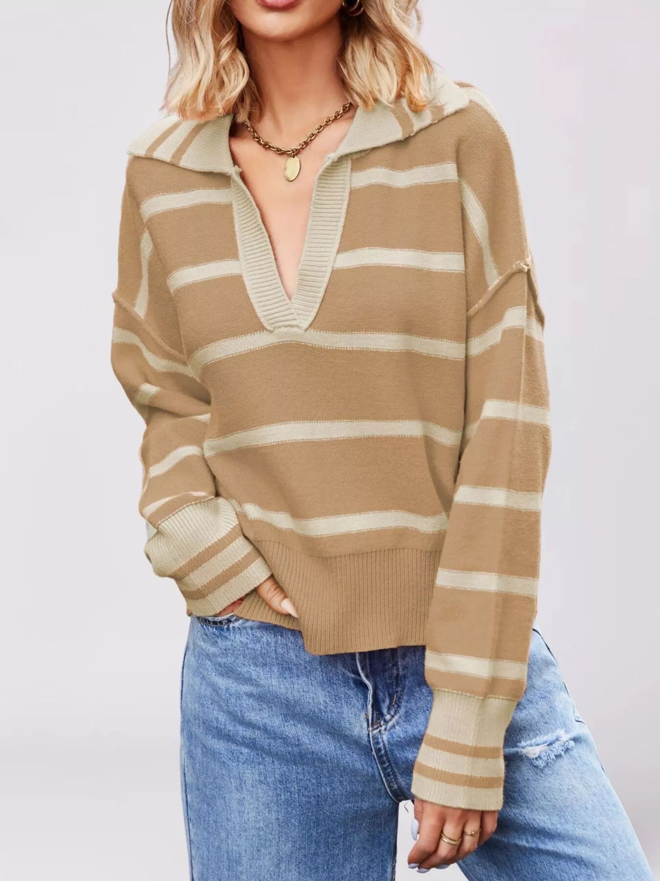 On-model front view of khaki striped sweater with cream Johnny collar and dropped shoulders