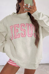 Beige crew neck sweatshirt with pink gingham JESUS lettering, front mirror view