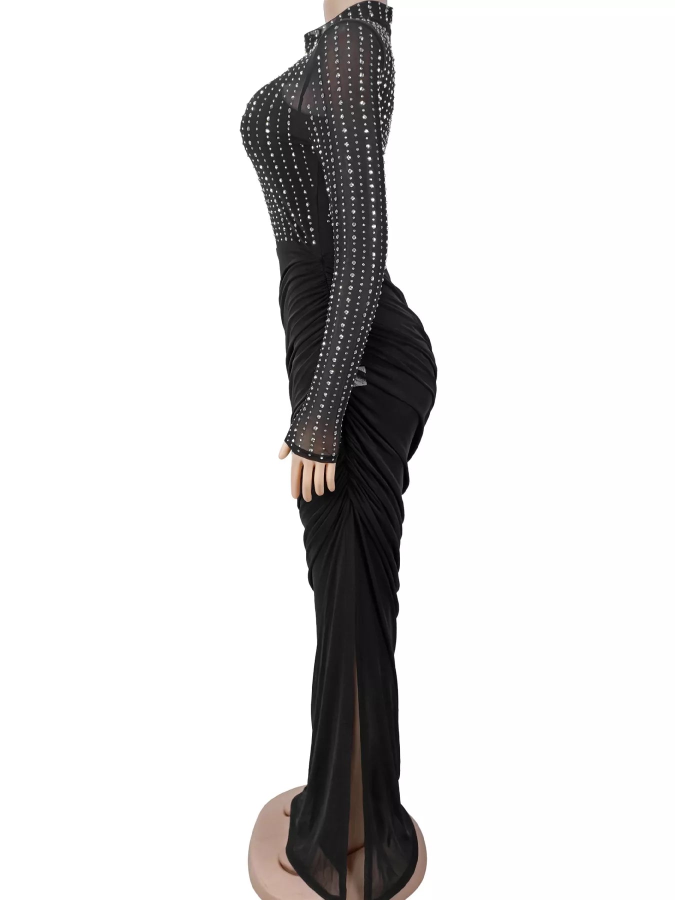 Black mock neck maxi dress with sheer rhinestone sleeves and side slit, side view on mannequin