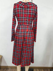 Burgundy plaid long sleeve midi dress on a mannequin, back view with wide collar and fitted waist
