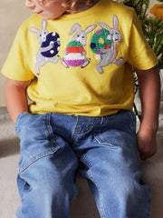 Children's gold short-sleeve T-shirt featuring an embroidered bunny design.