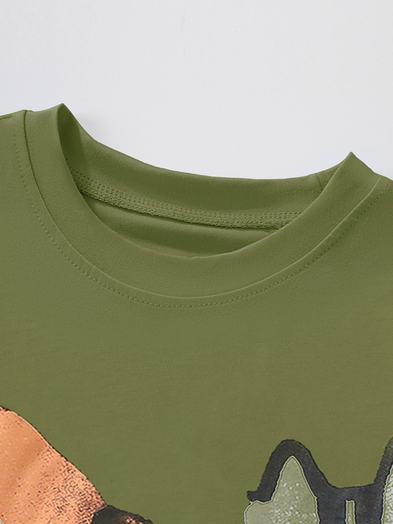 Close view of the moss green children's tee crew neckline showing smooth ribbing and neat stitching