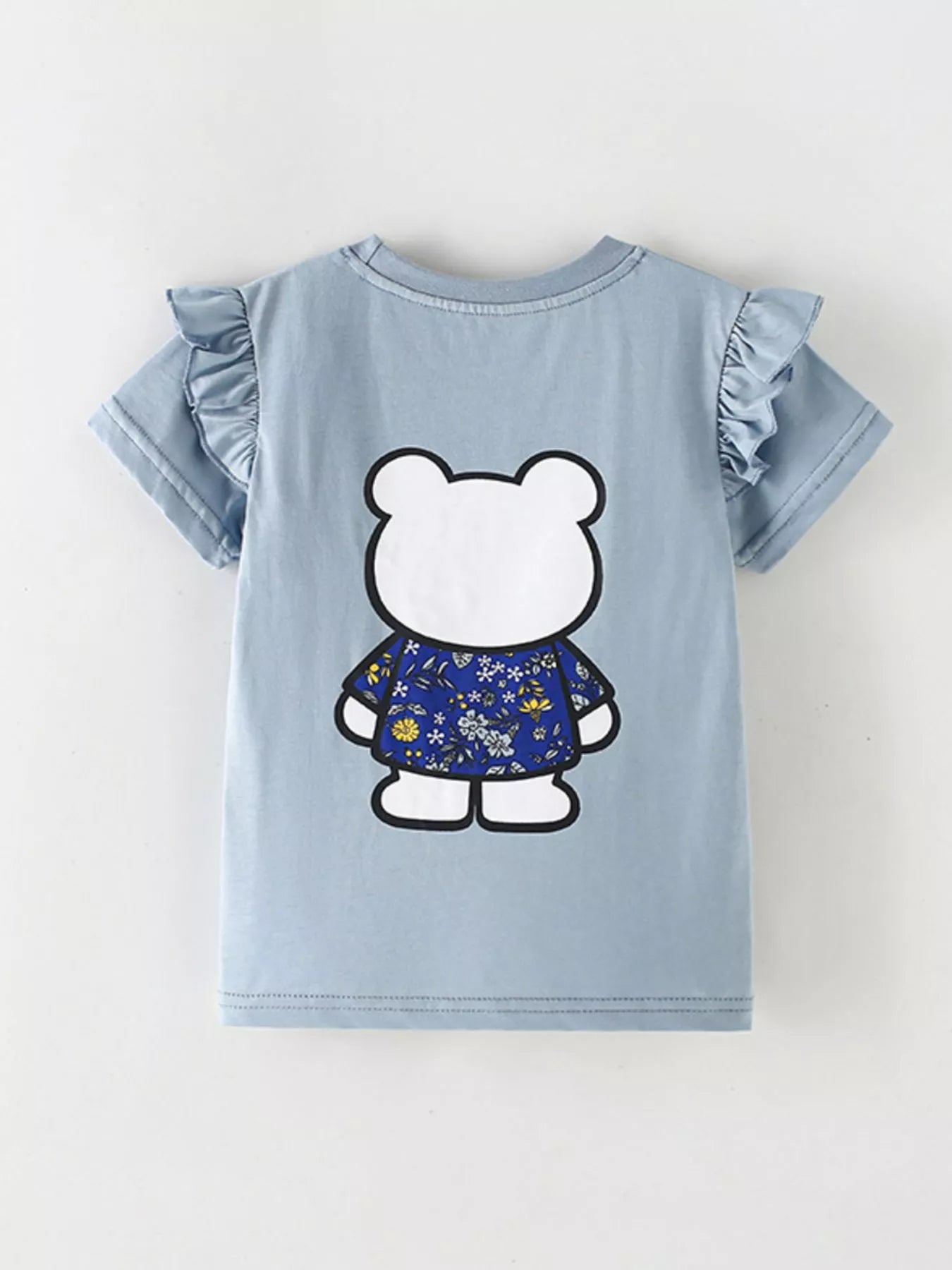 Flat lay back view of light blue children's t-shirt with ruffled sleeves and bear graphic from behind