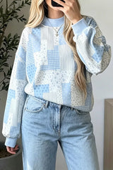 Light blue vintage patchwork dropped shoulder sweatshirt with floral, gingham and striped panels, front view