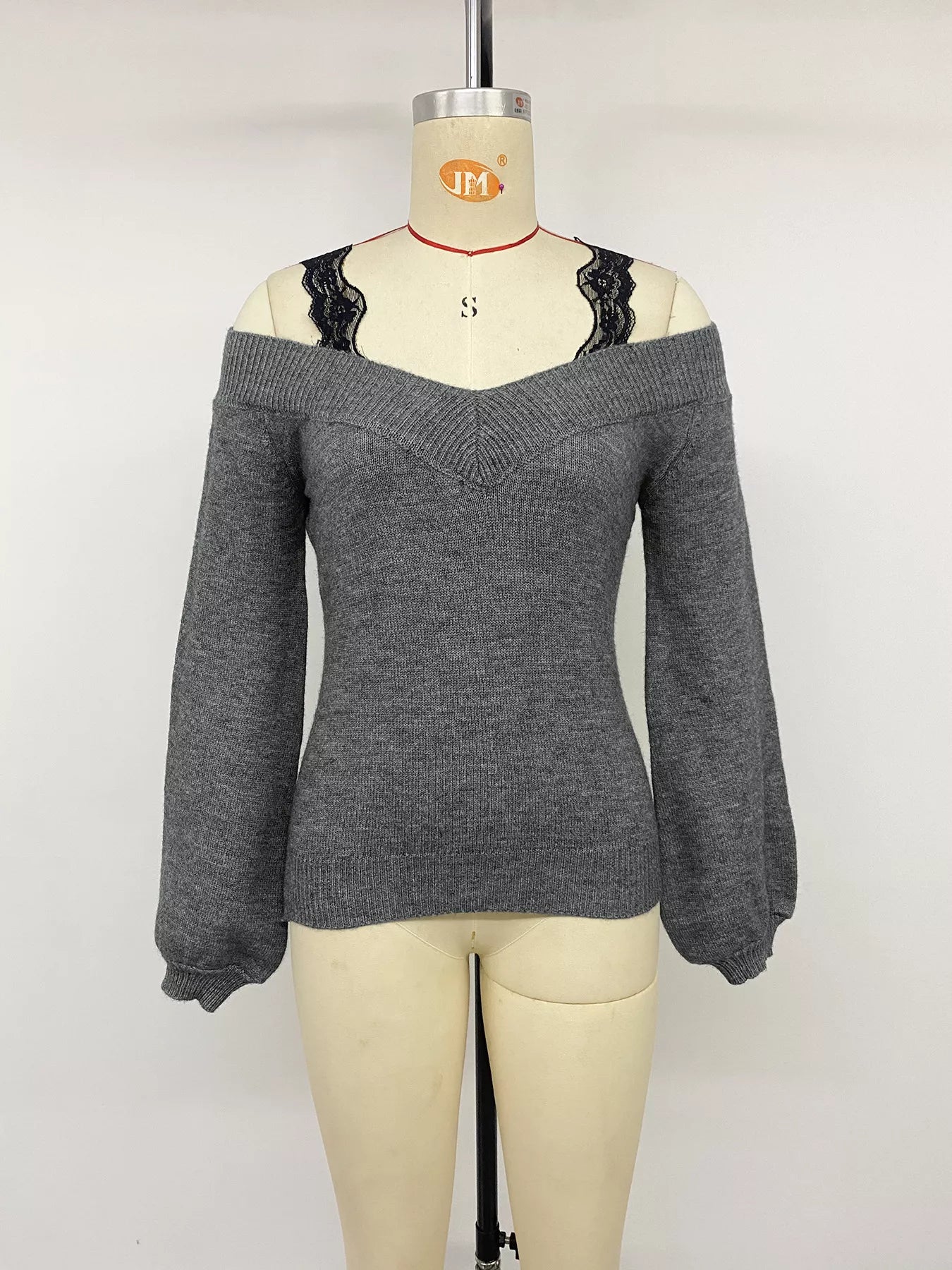 Dark grey off shoulder lace trim sweater with black lace straps on mannequin front