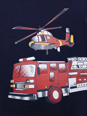 Close-up detail of red fire truck and helicopter graphic on dark navy children's t-shirt