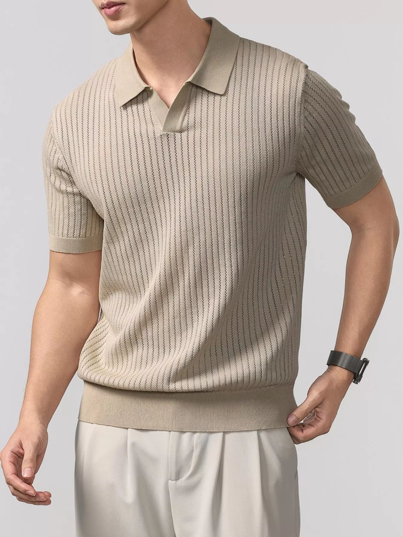 Men's ribbed short-sleeve knit polo with buttons and seam detailing.