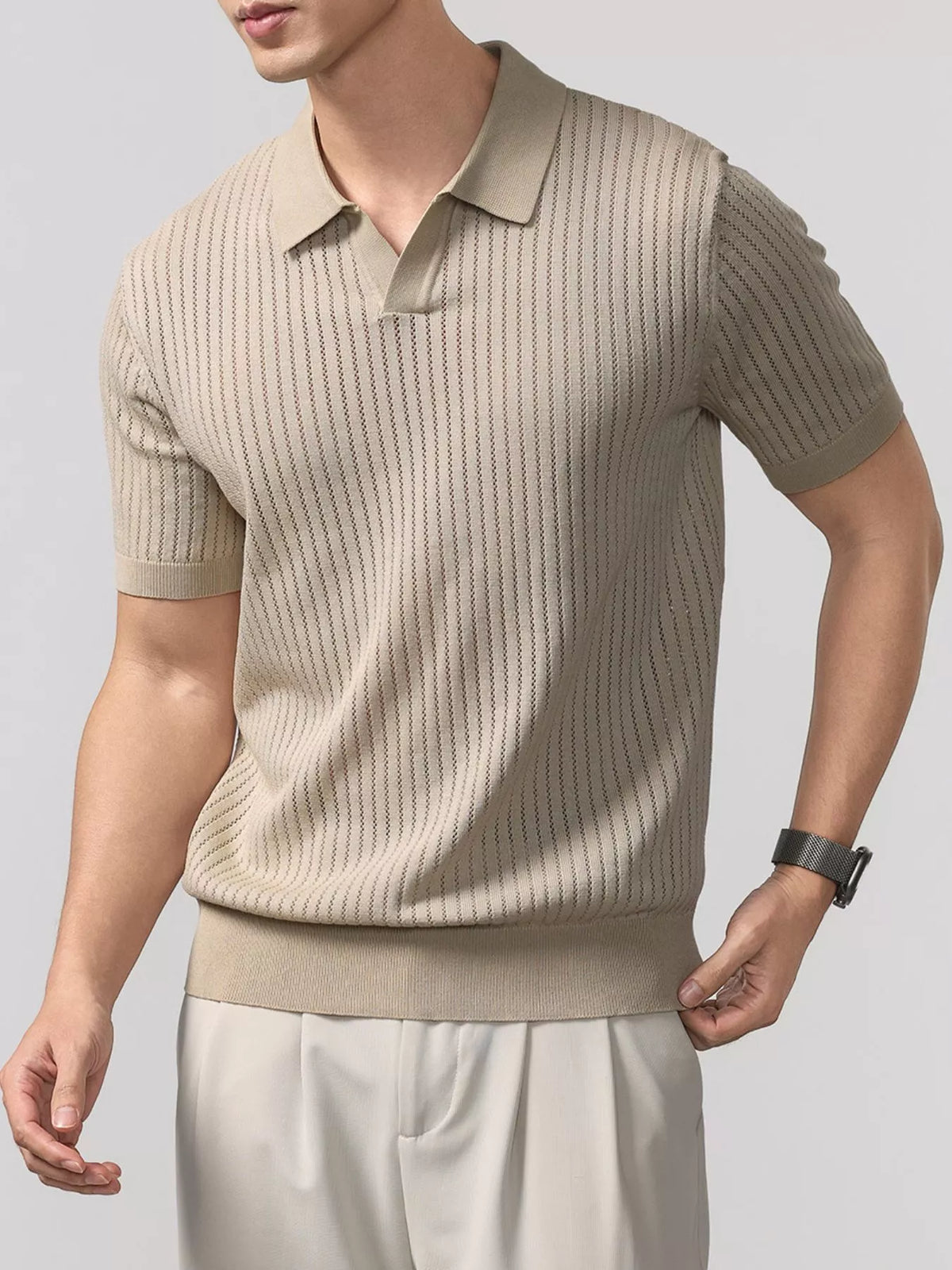 Men's ribbed short-sleeve knit polo with buttons and seam detailing.