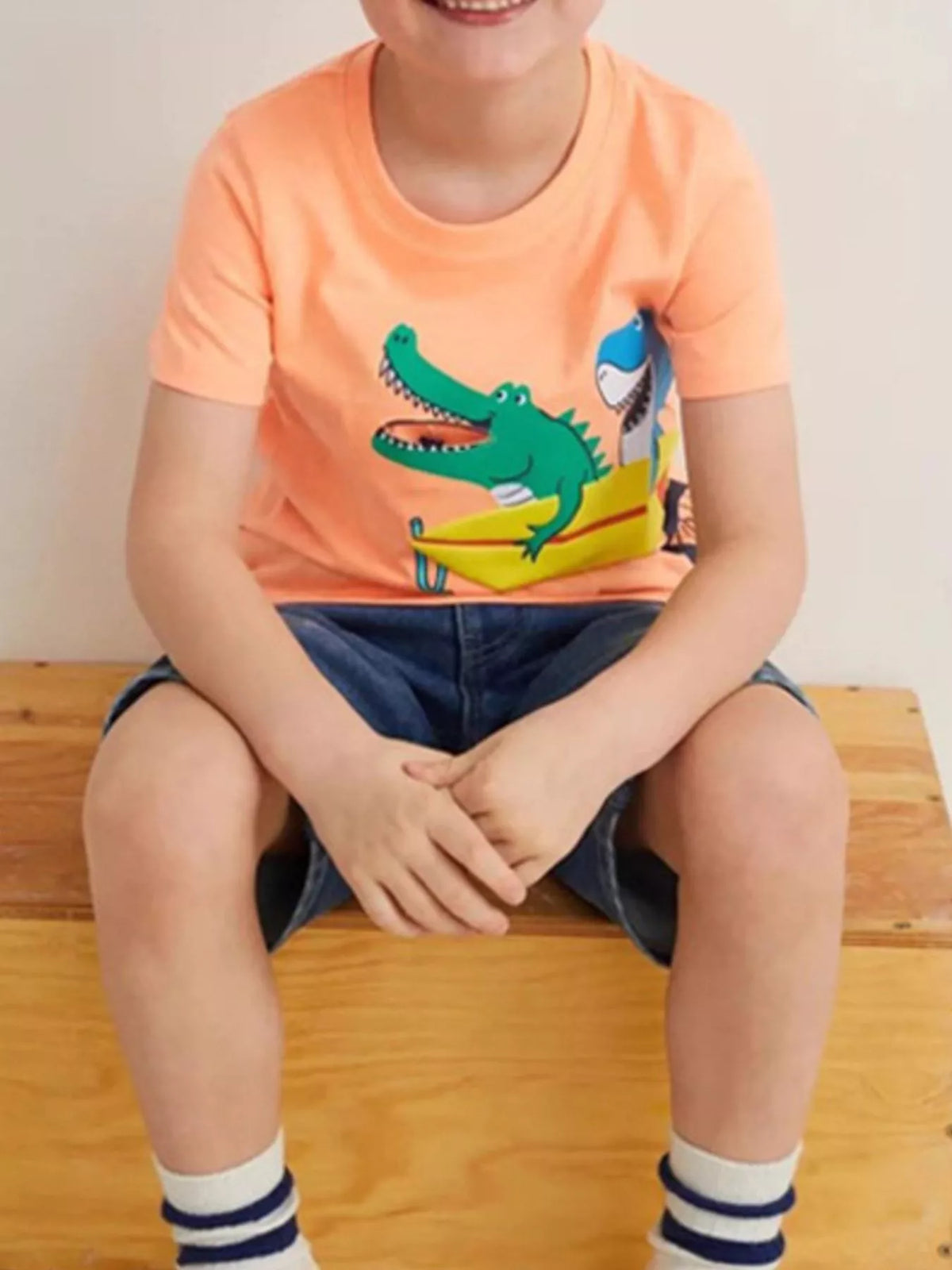 Children's short-sleeve T-shirt featuring a crocodile graphic design.