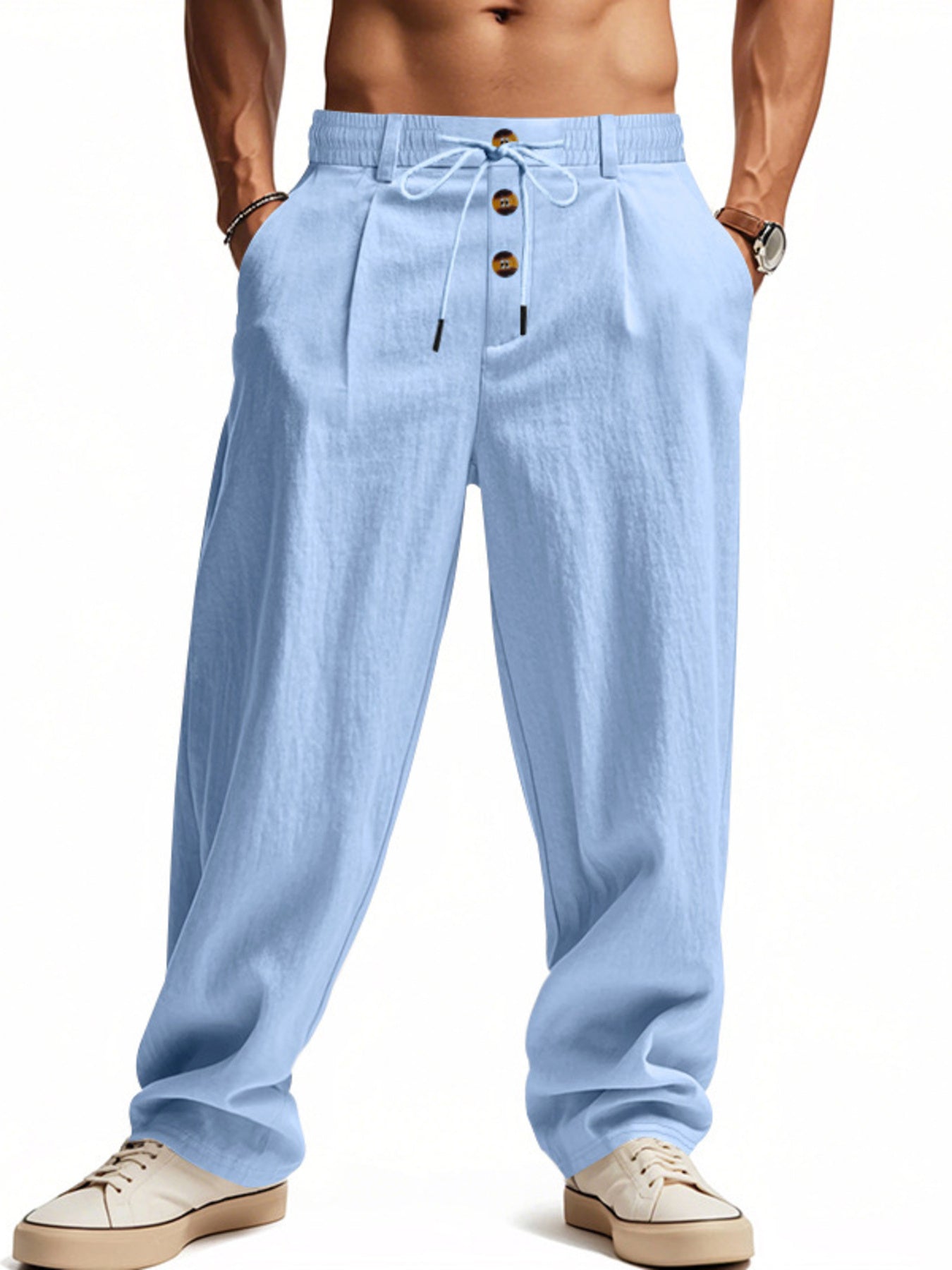Men's light blue loose-fit pants with a drawstring waist and pockets.