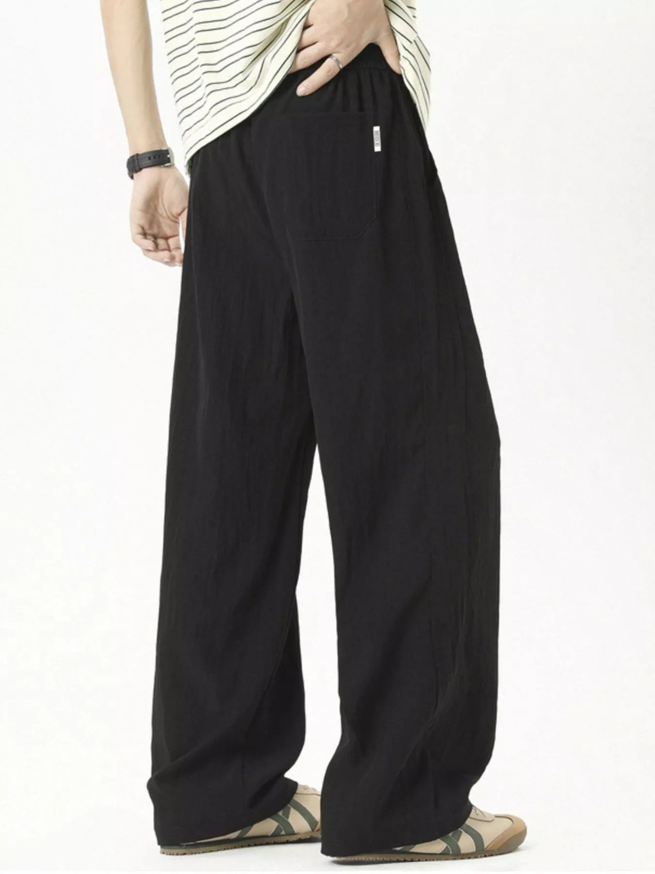 Men's lightweight loose fit casual pants with a drawstring waist.