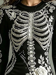 Close detail of white skeleton print on black long sleeve bodycon dress bodice