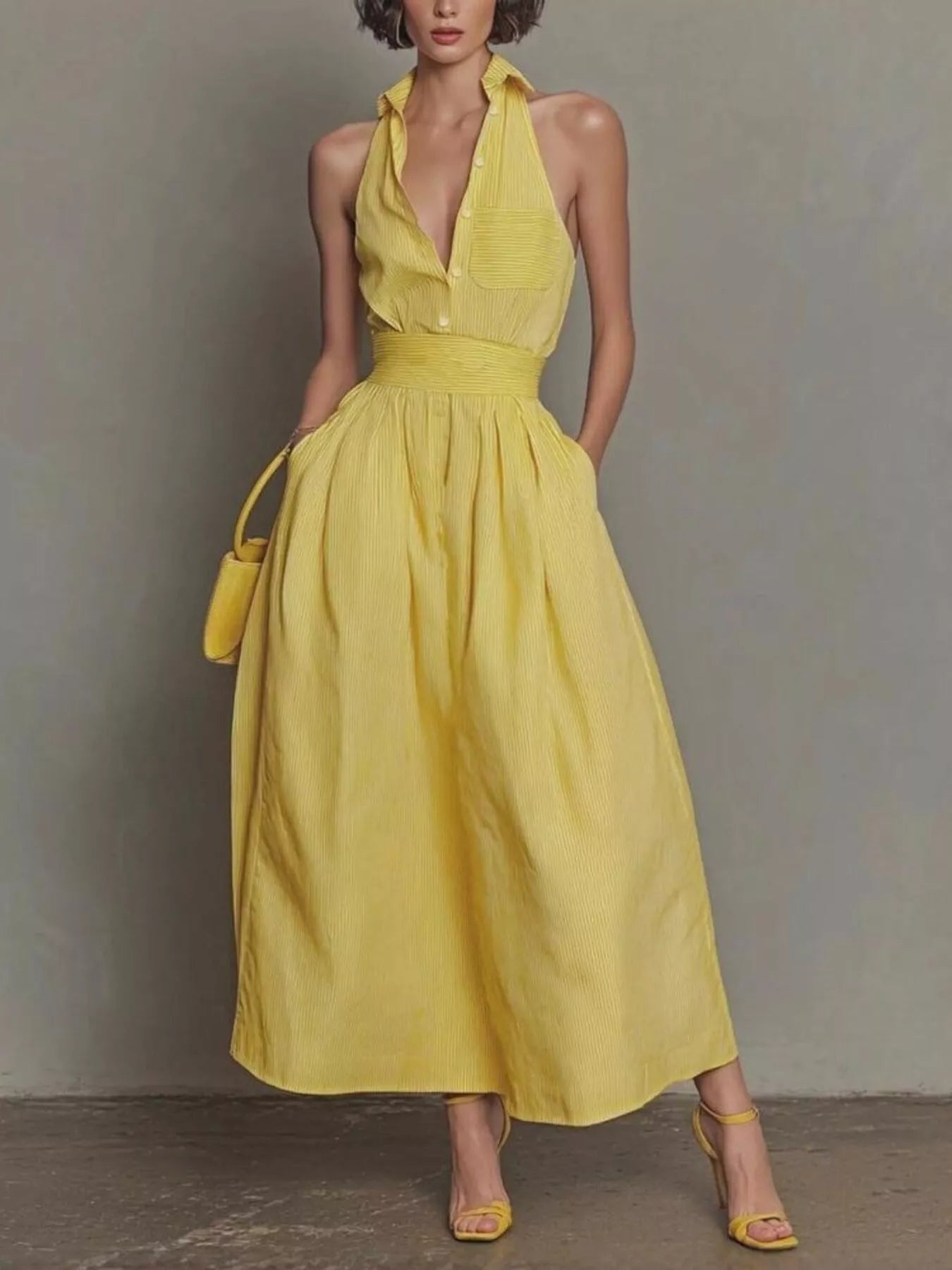 Full front view of yellow sleeveless maxi dress with collar buttons and side pockets