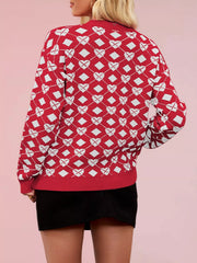 Back view of a red knit sweater with white heart and diamond argyle pattern