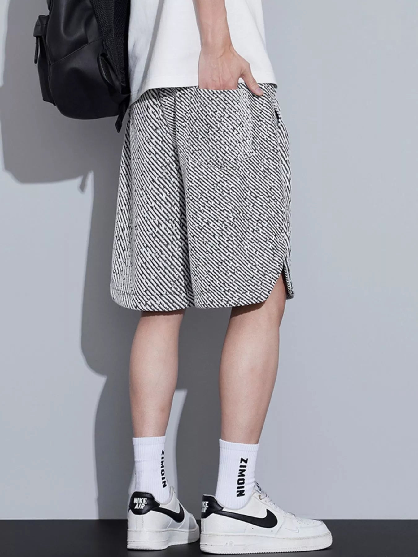 Men's loose fit shorts with a drawstring waist and pockets.