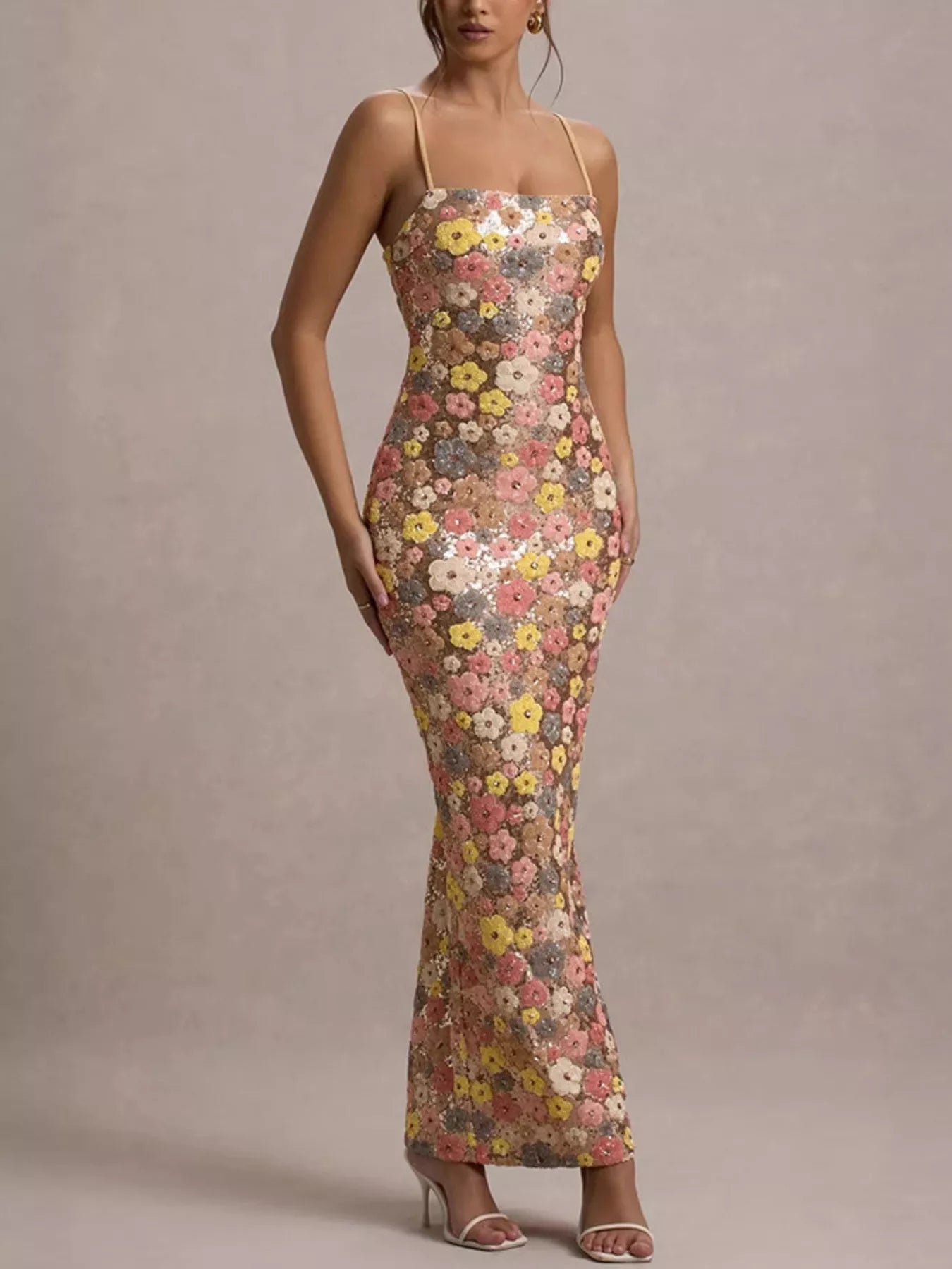 Front full length view of a multicolor floral sequin bodycon maxi dress with thin straps