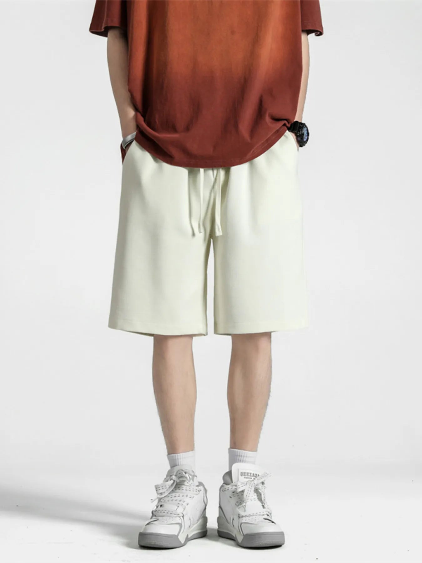 Men's loose-fit shorts with a drawstring waist in the Flower White color.