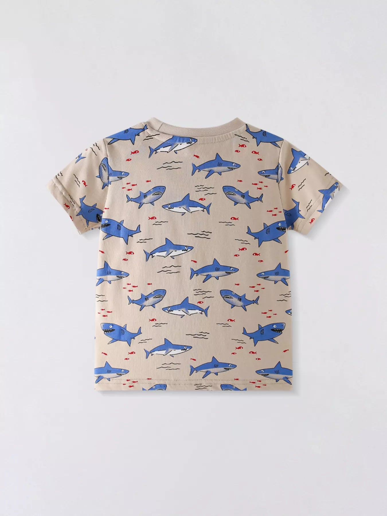 Back view of tan children's crew neck tee with all over blue shark print