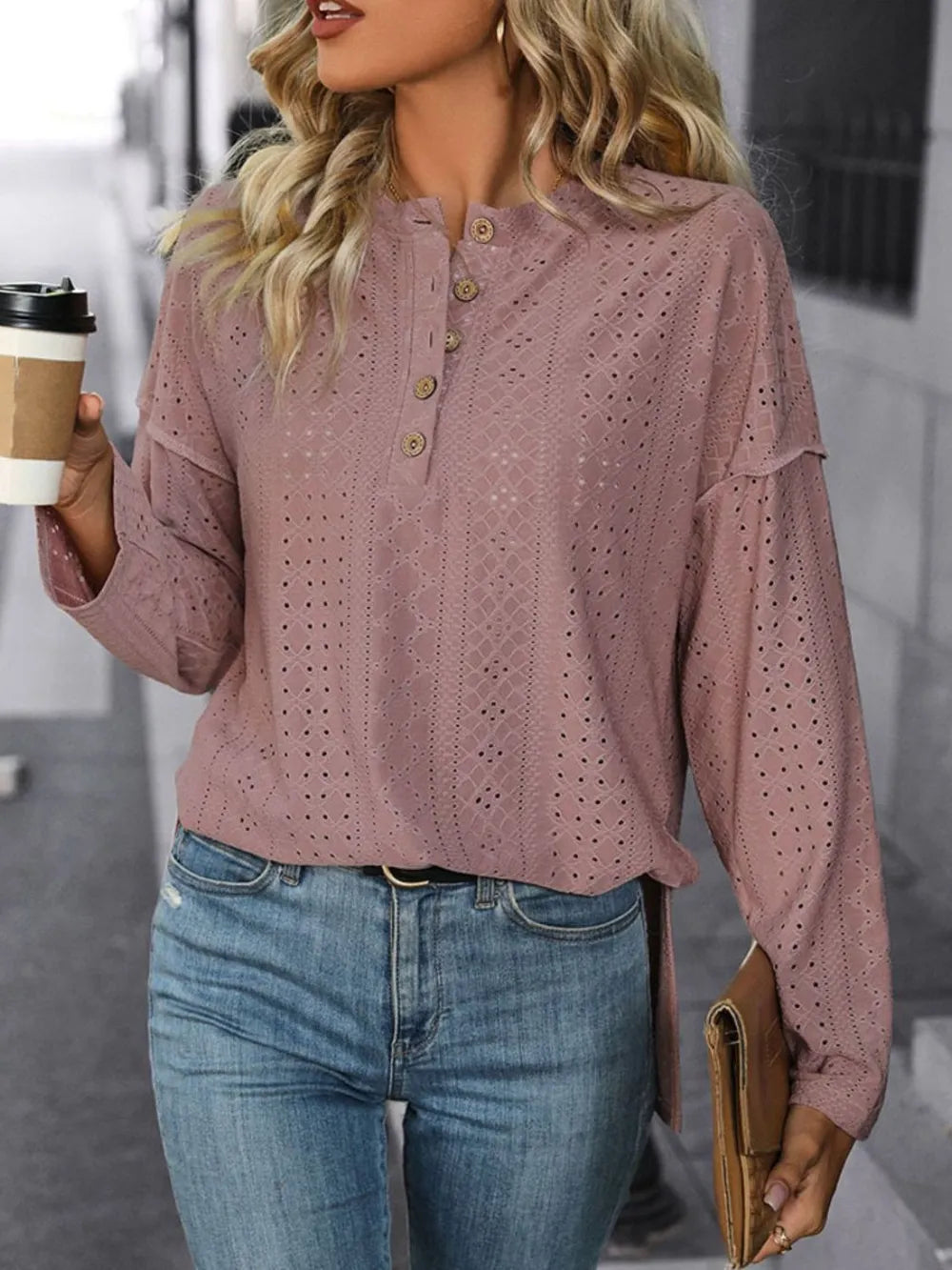 Mauve eyelet round-neck long-sleeve top with button placket, modeled with jeans and a coffee cup.