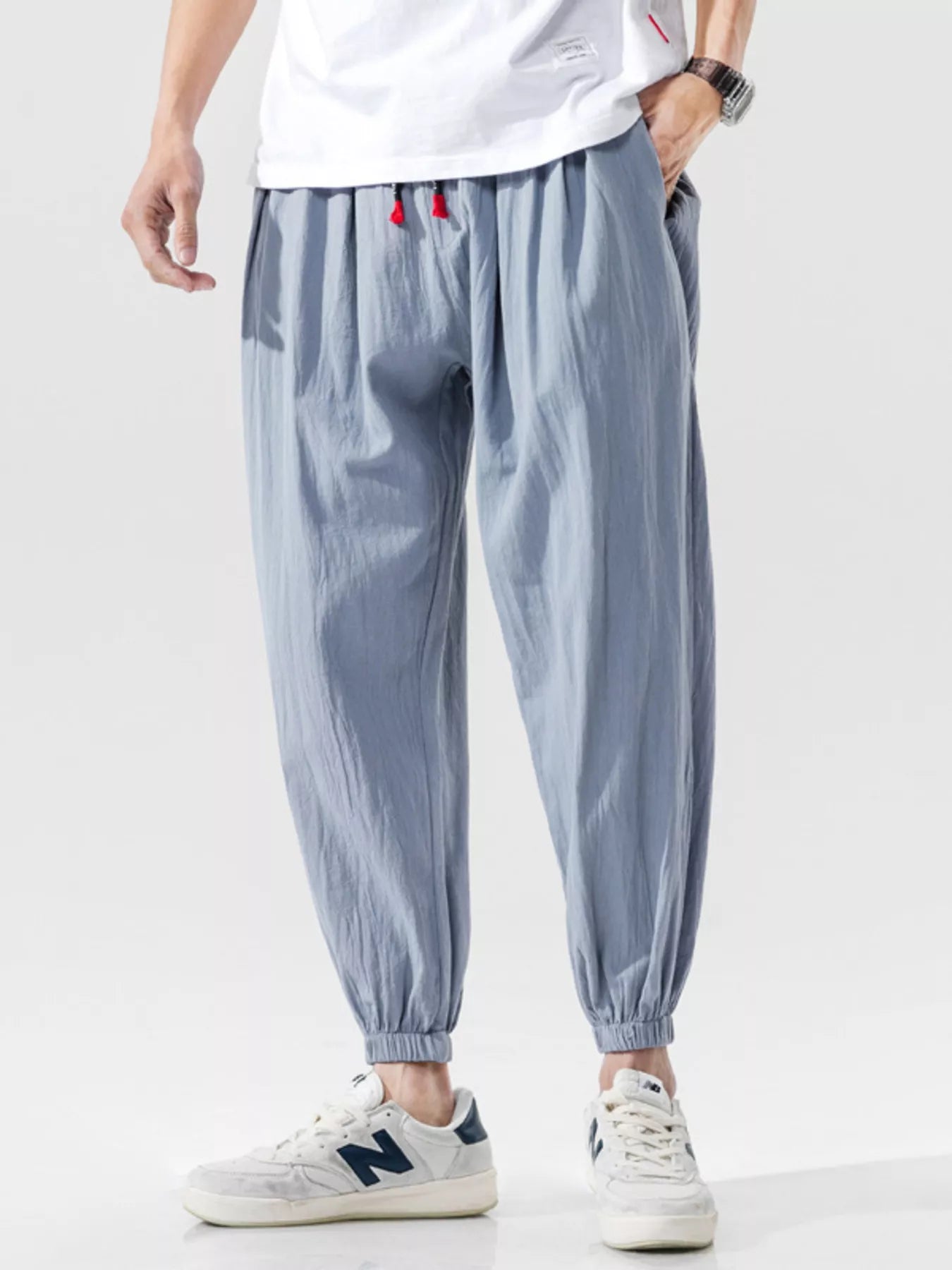 Men's loose fit joggers with a drawstring waist and pockets.