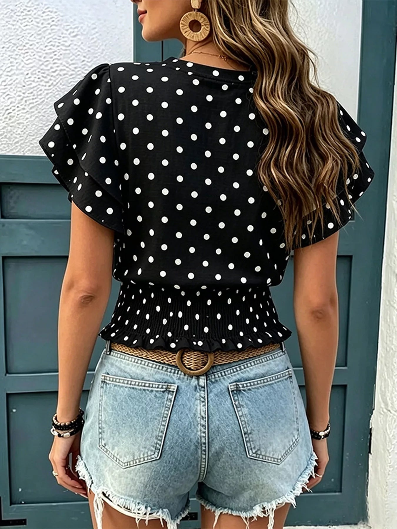 Back view of black polka